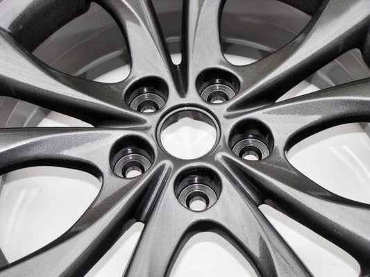 Close-up of a car wheel rim with a metallic finish powder coating